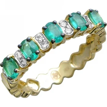 

Esthete ring with emeralds and diamonds in Yellow Gold