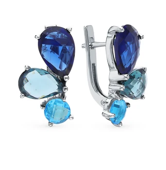 

Silver earrings with jewelry glasses sunlight sample 925