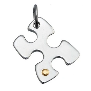 

Pendant steel detail central 18k gold 20mm. Puzzle Piece