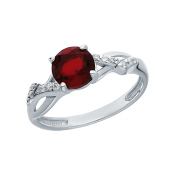 

Silver ring with cubic zirconia, Garnet and jewelry glasses sunlight