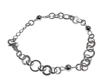 

Sterling silver bracelet combined with various shapes and balls hoops