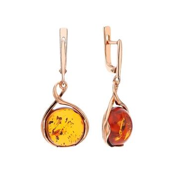 

Silver earrings with amber sunlight
