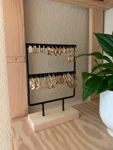 Soporte de exhibición para pendientes de tuerca de Metal con Base de madera, organizador de pendientes con 24/44/66 agujeros, venta al por mayor