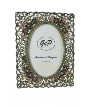 

Photo Frame metallic retro style with flowers and bright. Measurements: 17x13 cm.
