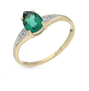 

Gold ring with emerald and diamonds sunlight