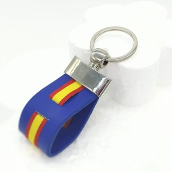 

Spain flag keychain with blue fundo.