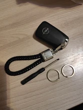 LLavero de lujo de alta calidad para coche, hebilla de herradura giratoria de 360 grados, cuero tejido a mano, colgante de bolso de Soporte para Llaveros para hombre y mujer