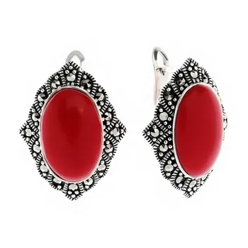 

Silver earrings with marcasite and coral imit.