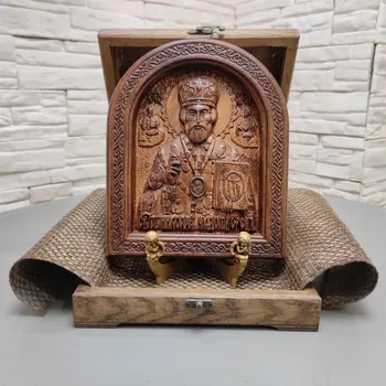 

Wooden icon of Nicholas the Wonderworker in a thick rounded frame measuring 19-23 cm