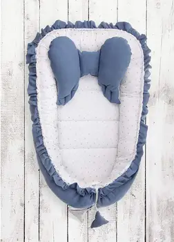 

Multifunctional nest model WINS in blue with star print. STUFFED COCONUT FIBER. CRIB REDUCER
