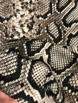 

Snake jersey fabric. Snakeskin jersey fabric. Python jersey fabric. Python fabric for coat. Brown python fabric.