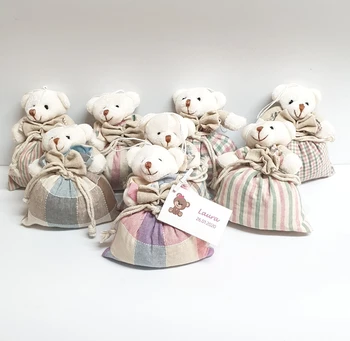 

Sachet scented Teddy with personalized card with name and date. Details for guests to a Christening or Baby Shower.
