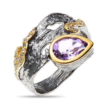 

Silver ring with Topaz White and amethyst