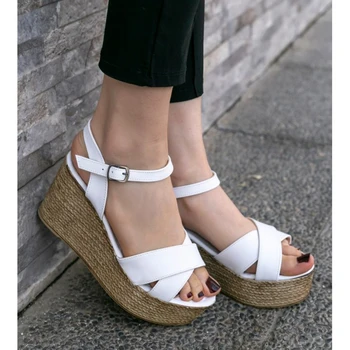

Açela White Wedges Sandals
