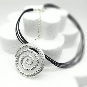 

Women's necklace in silver tone spiral shape with cord.