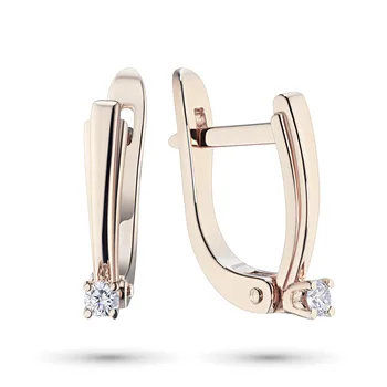 

Earrings in red gold with a diamond