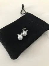 Creative Simple Craft Animal lindo 925 Sterling Silver plateado pequeño gato hueco perforado perla mujer pendientes SE64