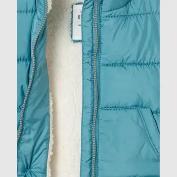 

Turquoise baby vest with tassel