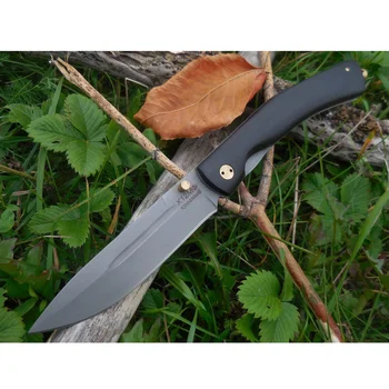 

Folding knife with forged Damascus steel blade, grab handle