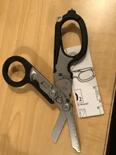 Tijeras de Respuesta de Emergencia Raptor 6 en 1, con cortador de Correa y interruptor de vidrio negro con funda Compatible con MOLLE