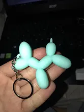 Nuevo creativo de dibujos animados globo de Llavero perro colgante anillo de hombres y mujeres par bolsa de llavero colgante venta al por mayor