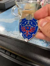 Unisex llavero escudo Hylian/Sheikah pizarra clave colgante cadenas Anime baratija llavero colecciones clave anillo