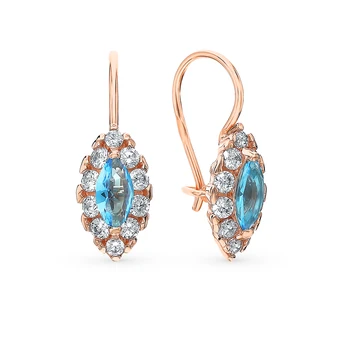 

Silver earrings with cubic zirconia and jewelry glasses sunlight sample 925