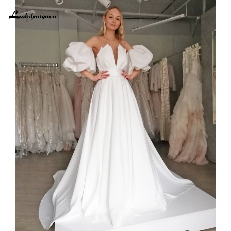 

Женское свадебное платье с V-образным вырезом и пышными рукавами