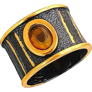 

Esthete ring with Amber made of black silver with gilding