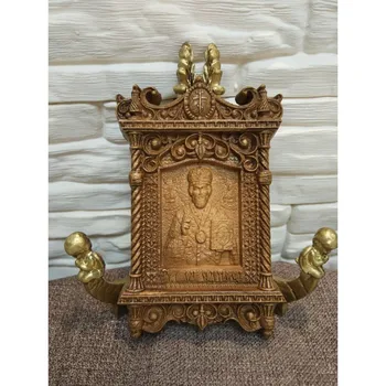

A small carved icon of Nicholas is 10-15 cm in size