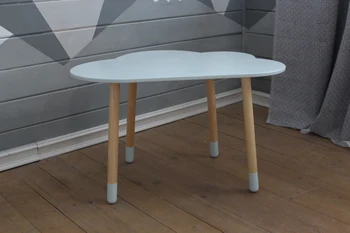 

Table made of natural wood cloud in a children's table for drawing the interior of children's
