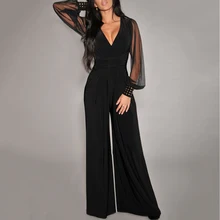 

New women Sexy Casual V-neck mesh stitching rivet straight Wide leg jumpsuit Professional wind Transparent sleeve jumpsuit