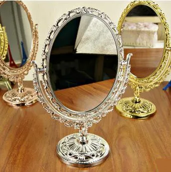 

European Antique Style Bronze Rotatable Desktop Cosmetic Mirror with Flower Embossing Ellipse Makeup Mirror portable mirror