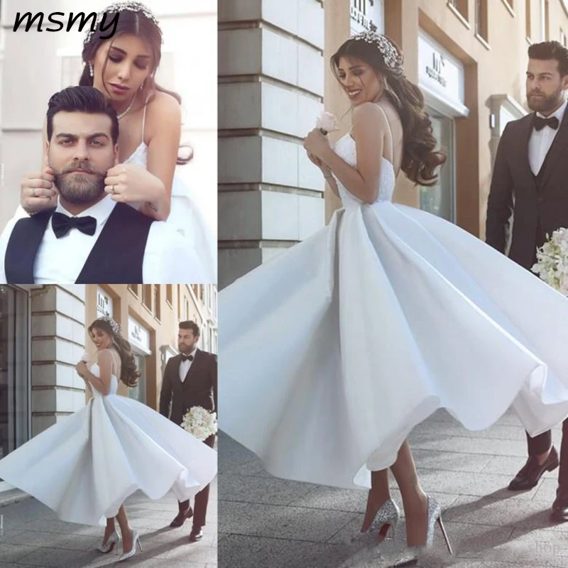 

2019 Saudi Arabic A-Line Satin Wedding Dresses Spaghetti Appliques Tea Length Dubai Bridal Gowns Cheap Backless abiti da sposa