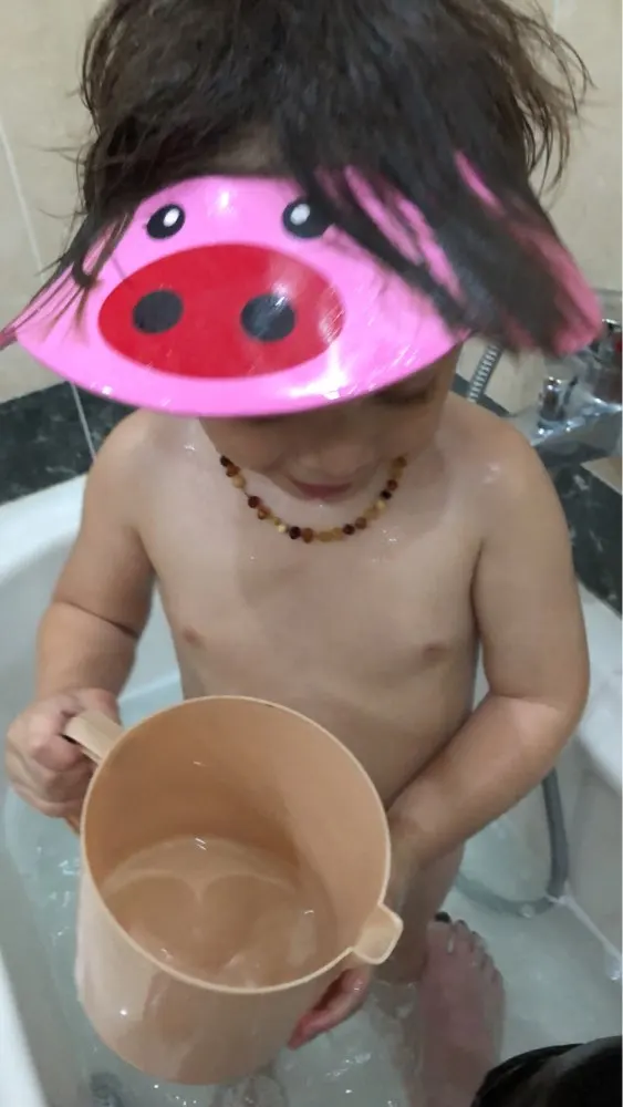 Bonnet de douche à imprimé pâquerettes pour enfant