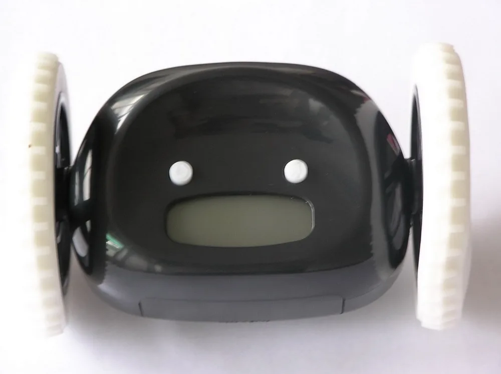 

HOT-Moving Runaway Running On Wheels Digital LCD Alarm Clock Chase the Alarm