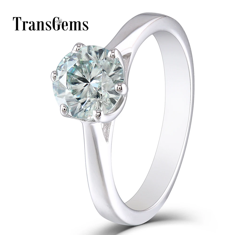 

TransGems 10K White Gold Center 1ct Engagement Ring 6.5MM Diameter 8 Heart and Arrows Cut Slight Blue Moissanite for Women Gift