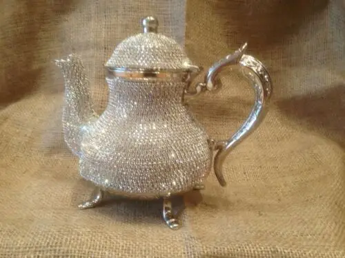 

Swarovski decorated stones , copper tea pots high value Hand made luxury silver