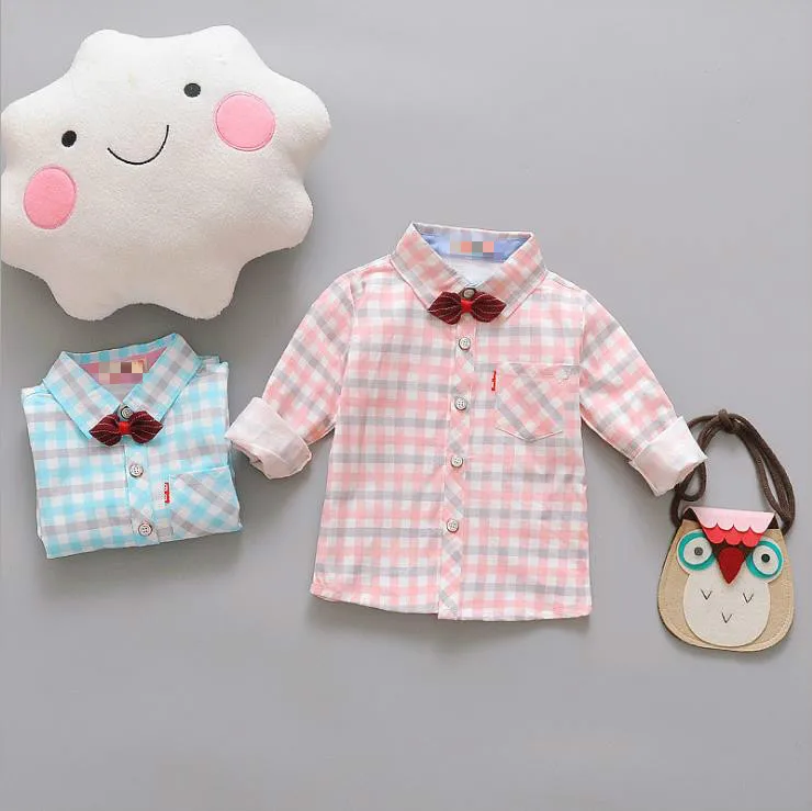 

Boy's checked long sleeve shirt, wearing bow tie, like a gentleman!