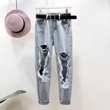 Уничтожено женские джинсы с отверстиями TA1040