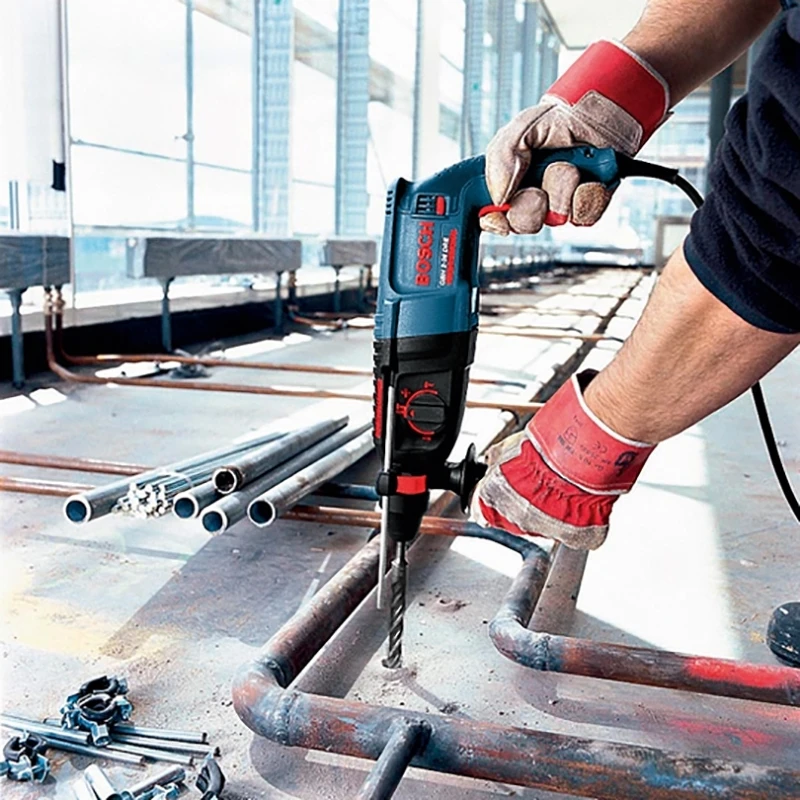 Перфоратор электрический Bosch GBH 2-26DRE (Мощность 800 Вт, сила удара 2,7 Дж, Патрон SDS+,900 об/мин, 4000 уд/мин, максимальный диаметр сверления по дереву 30 мм, металлу 13 мм, бетону 26 мм, коронкой 68 мм, 3 режима работы)