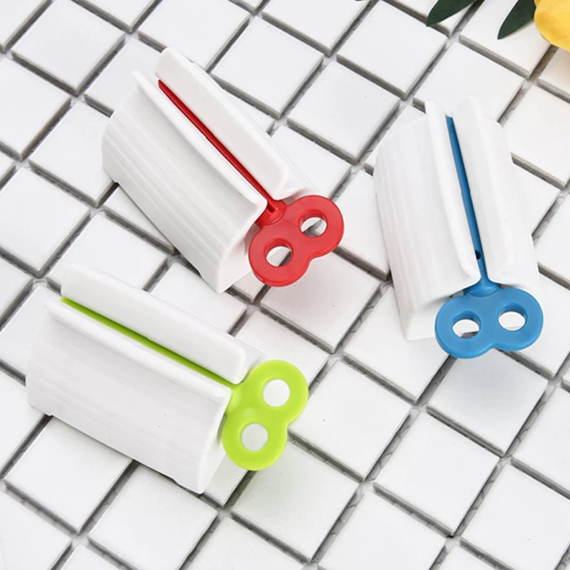 

Multifunctional Bathroom Plastic Cream Tube Squeezing Dispenser Rolling Tube Squeezer Tooth Paste Squeezer Toothpaste Dispenser