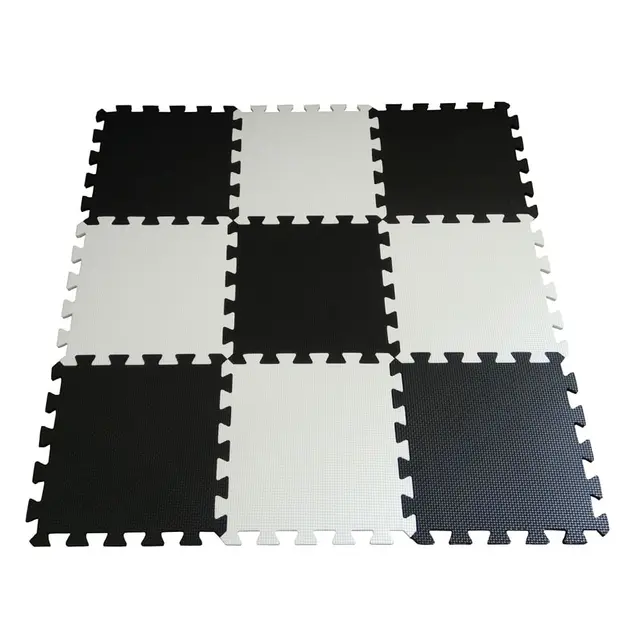 grey and white puzzle play mat