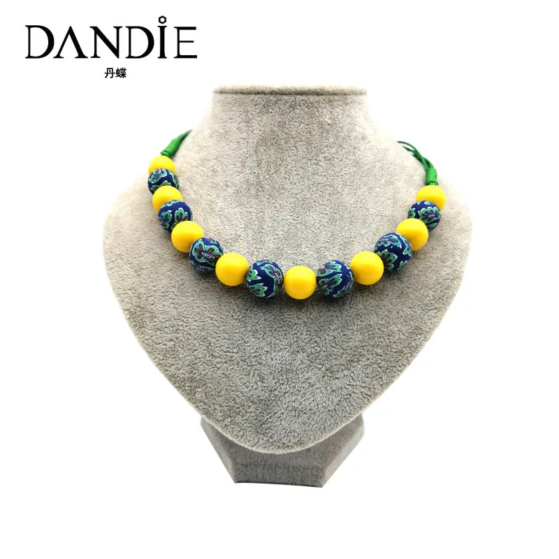 

Dandie short necklace with yellow acrylic bead and soft pottery bead polymer clay necklace