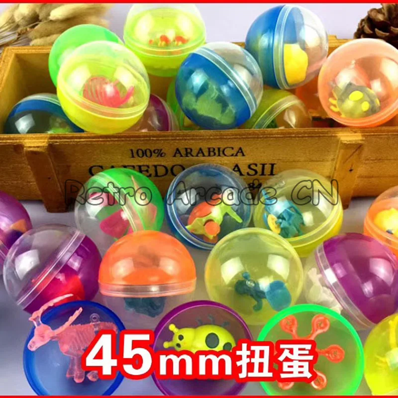 

100pcs/lot 45mm diameter plastic color balls capsules toys with inside mini dolls toys randomly mix for arcade vending machine