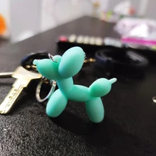 Nuevo creativo de dibujos animados globo de Llavero perro colgante anillo de hombres y mujeres par bolsa de llavero colgante venta al por mayor