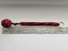 LLavero de seguridad para exteriores, cuerda de seguridad de autodefensa con rodamiento de bolas de acero negro Puño de mono