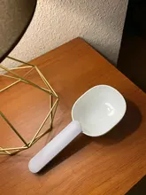Cuchara de Alimentación de Mascotas multifuncional para perros, cuchara con bolsa sellada, vaso de medición creativo, diseño curvo, fácil de limpiar
