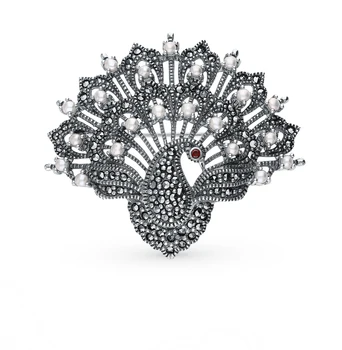 

Silver brooch with marcasite, Garnet and pearls sunlight sample 925 test