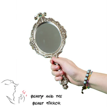

Hand Mirror "Beauty and the Beast" silver Antiqued-Designed in Italy